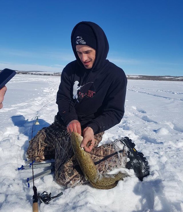 Pro-staff <a href="/AdamTurnbull05/">Adam Turnbull</a> unhooking a nice Burbot. fishbigworld.com #fishing #burbot #icefishing #fishbig #Alberta