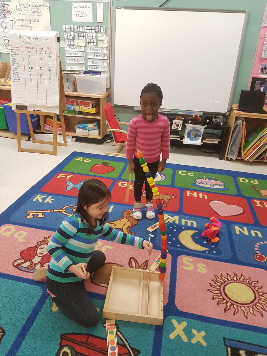 Mister_McLean's tweet photo. We discovered that by putting more dowels inside the beads, we could make a super tall, (and tippy) tower! We love to experiment and make discoveries each day! 😎 #StMichaelOCSB #KindergartenLife #DesignersAtWork https://t.co/2Gry4euzPv