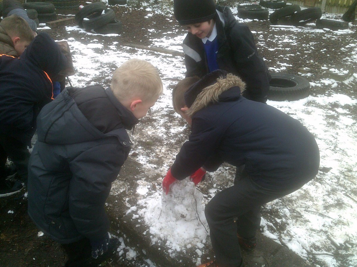 Making the most of the snow at playtime today! Mini snowmen building.