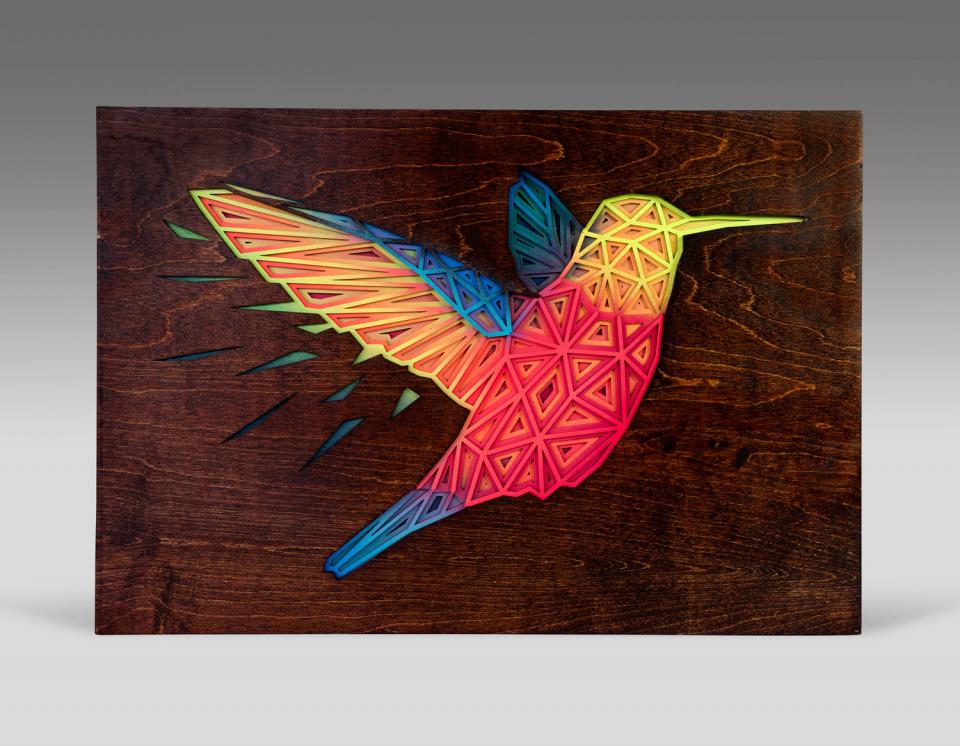 Beautiful shadowboxes are made from laser-cut pieces of dark Oak