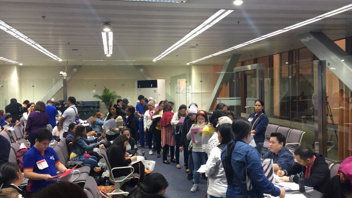 DFAPHL's tweet photo. Around 150 OFWs from Kuwait arrived in Manila today. Majority are household service workers granted amnesty by Kuwait. #KuwaitUpdate https://t.co/moUyColHHS