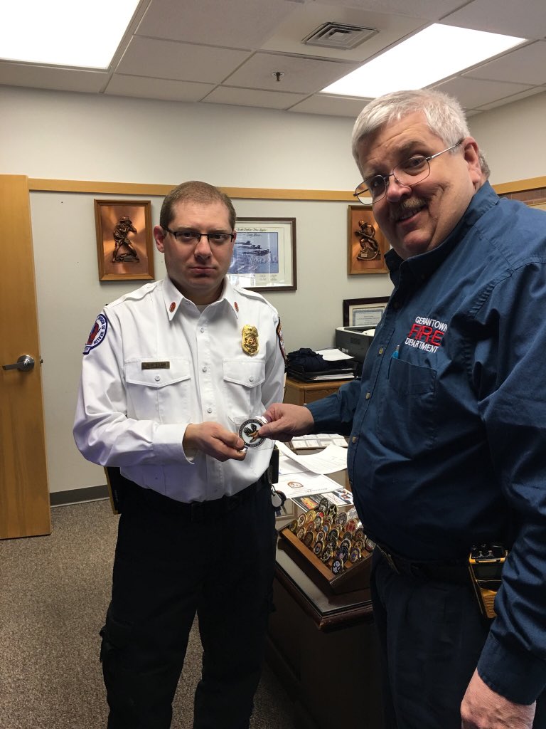chiefweiss33's tweet photo. Passing of the Sons of the Flag “Buddy are you ok” challenge coin from Chief Weiss to Deputy Chief Delain.  #SOTFBCC https://t.co/dWFLNVC8W8