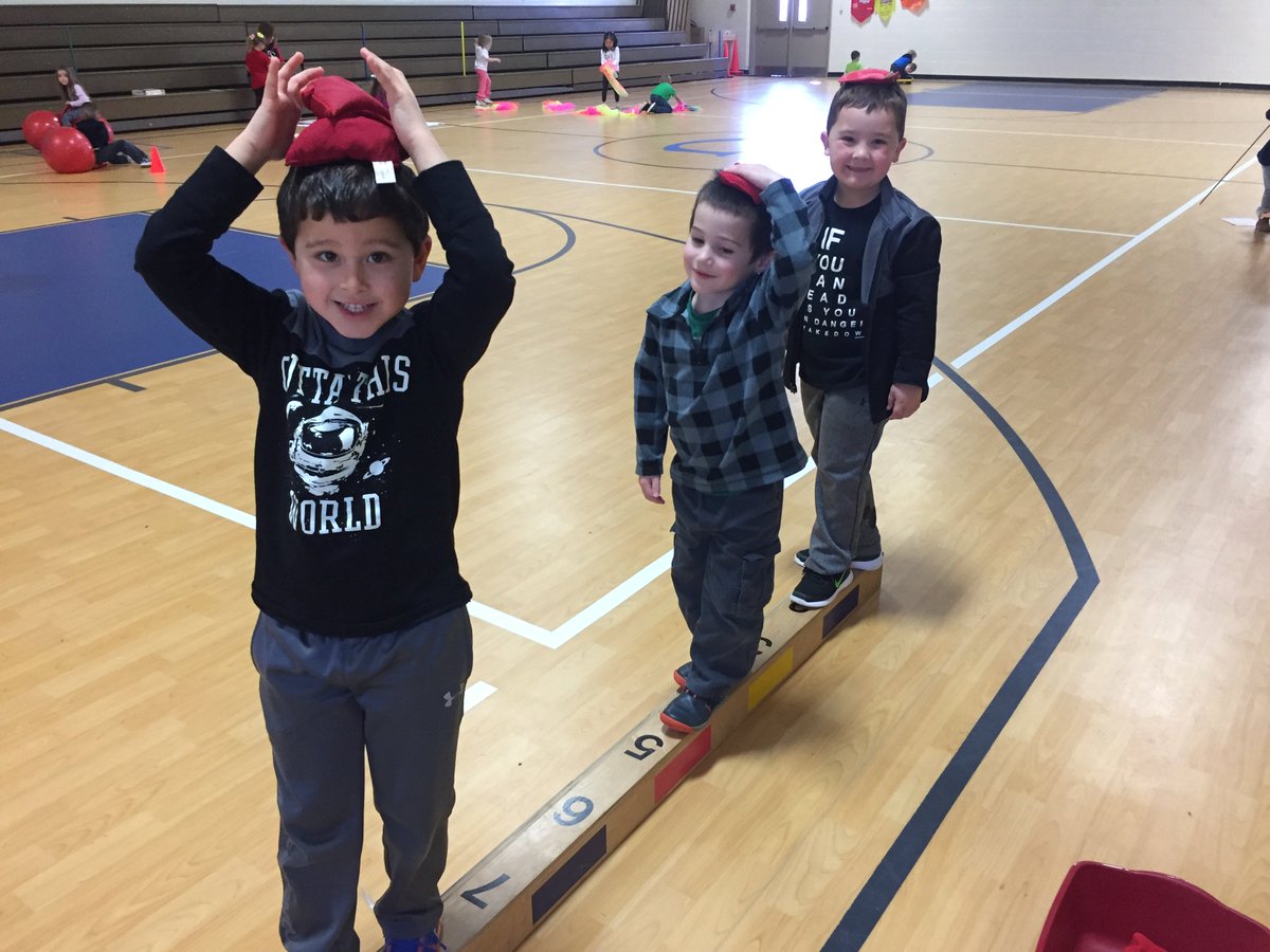 PreK Ss participating in stations based on favorite Dr. Seuss books. 
McElligot's Pool, Hop on Pop, and Ten Apples on Top are some of our favorite stations!
#ReadAcrossAmericaWeek #PhysEd