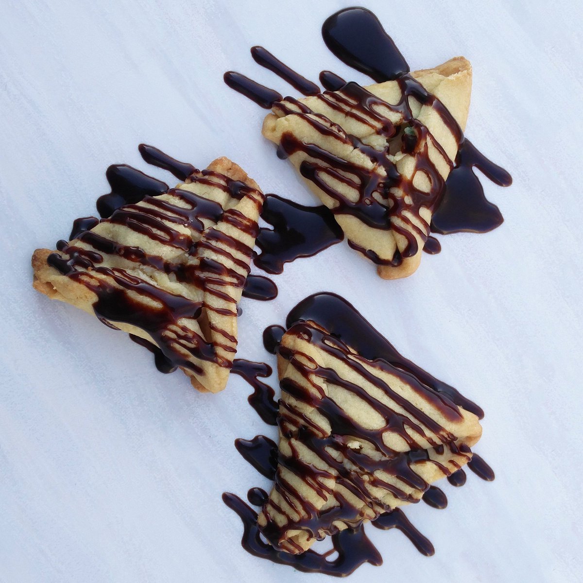 Cheesecake filled, chocolate drizzled Hamantaschen... life does not get better 😍 Recipe on Facebook- goo.gl/i5D2fx