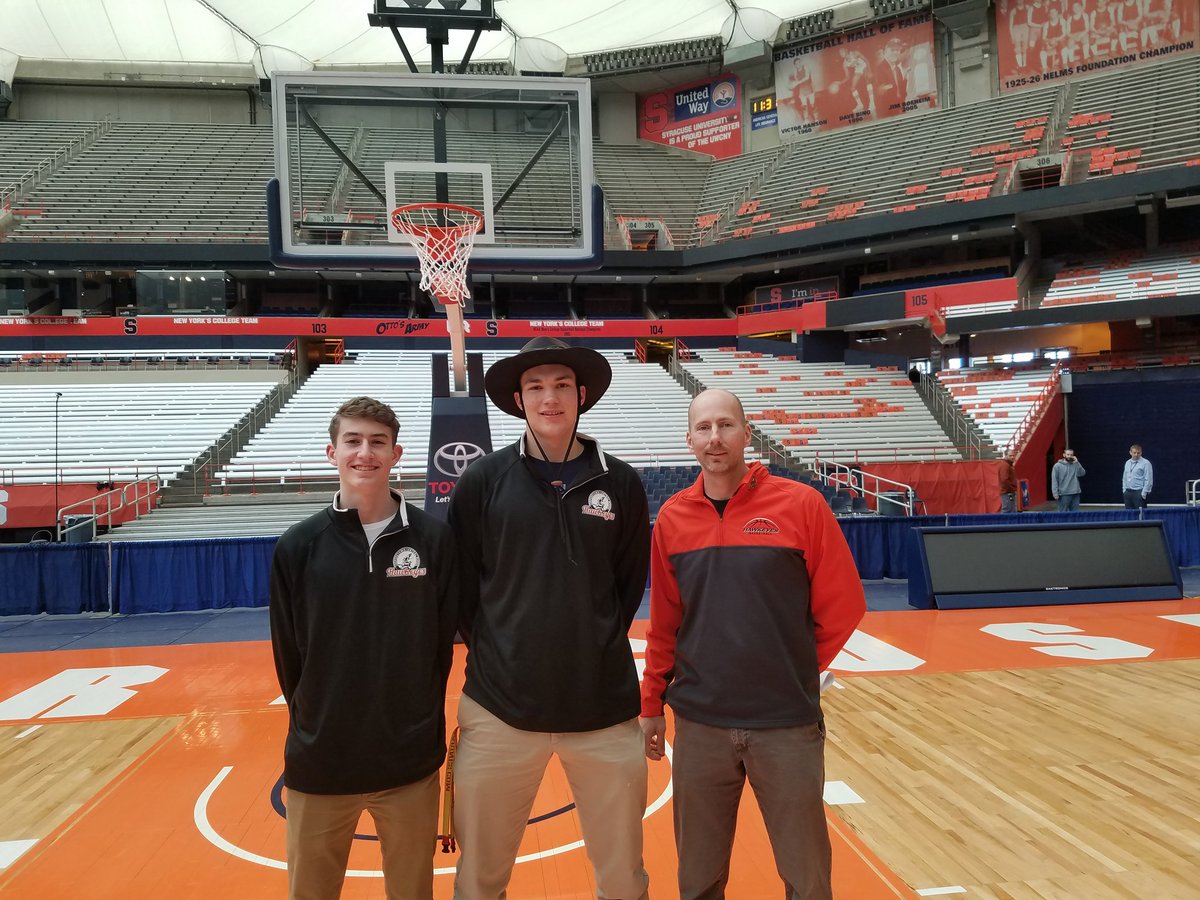 AthleticsCcs's tweet photo. @Coophoop33 captains @OPKennedyjr @jplambo20 and coach @DavidBertram13 pose underneath the hoop at the Carrier Dome after today's walk through! https://t.co/UUfk1oNvzQ
