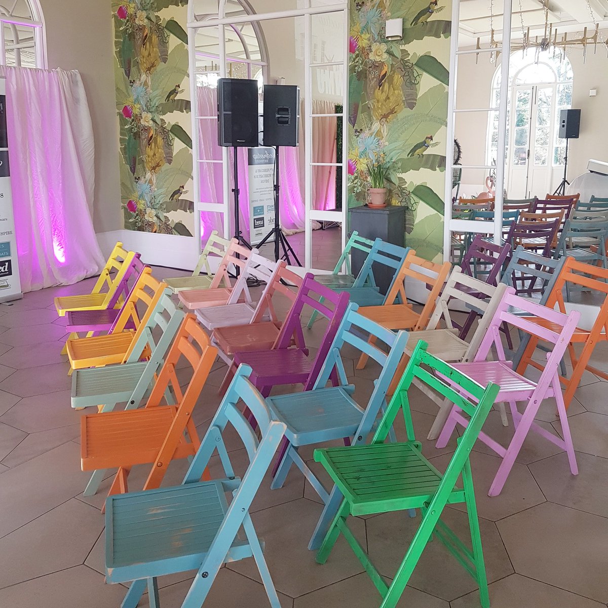 weddinghelperuk's tweet photo. So much colour from @The_PropFactory at @wedmeetupuk today! How great are these folding chairs! 💜💛💙💚 https://t.co/z50oZLthU3
