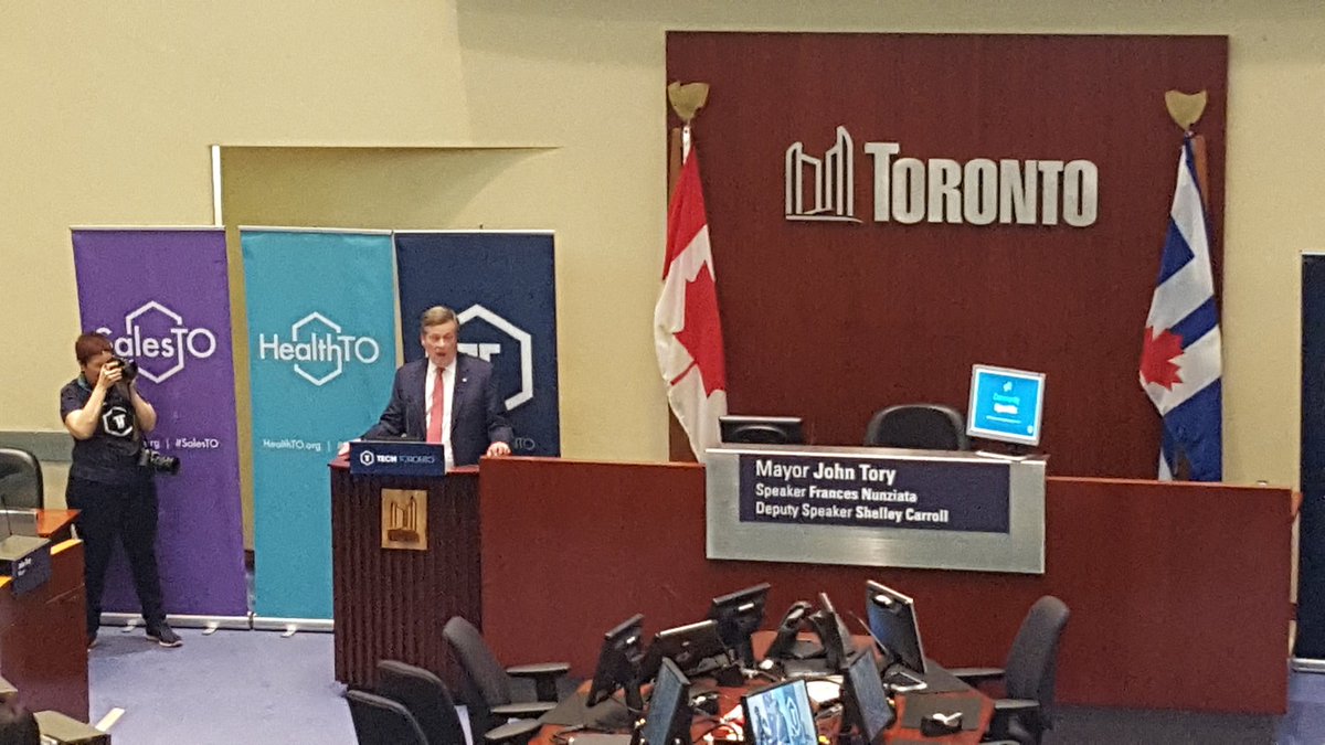 TechTO's tweet photo. Mayor @JohnTory addresses the audience at #TechTO and talks partnerships between the city of Toronto and the tech community https://t.co/7pVxjOP5LV