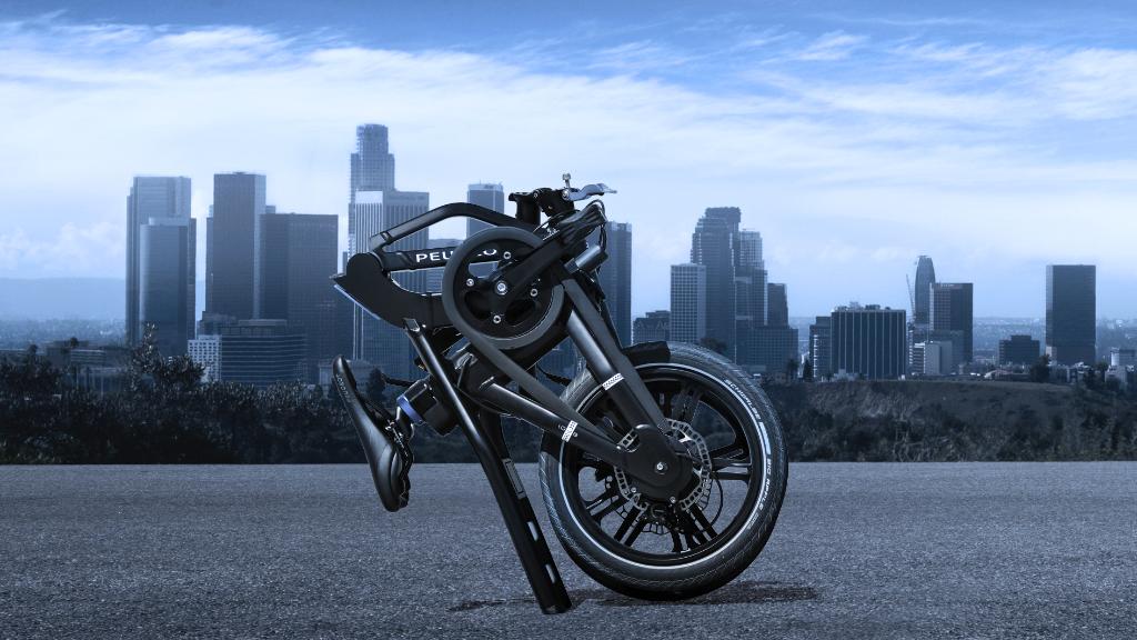 Peugeot's tweet photo. Bet it fits in your boot! Peugeot #eF01. https://t.co/oWouULLlYX
