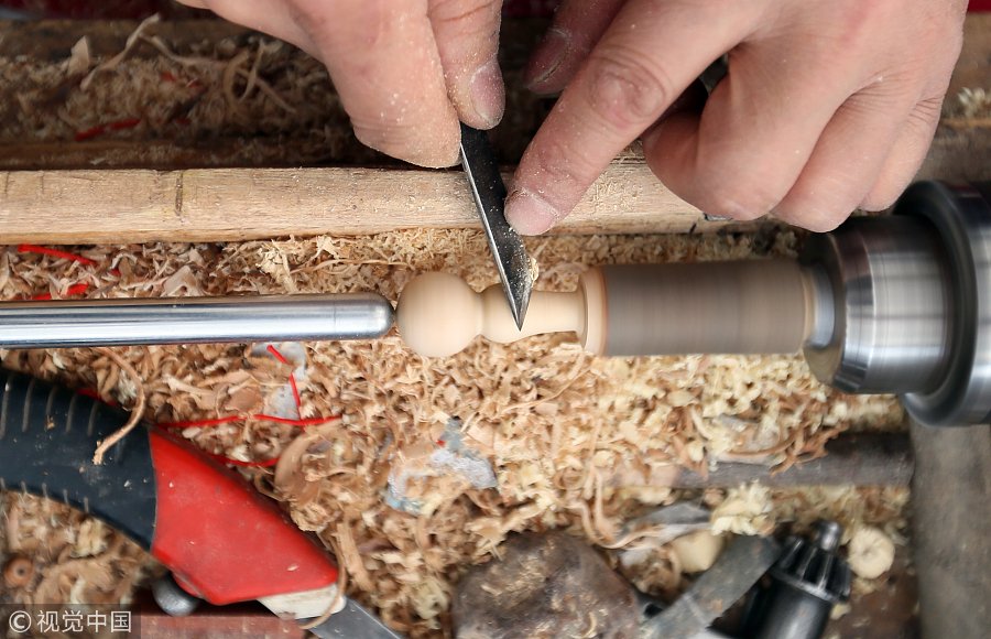 ChinaDaily's tweet photo. Zhou Helin, a #craftsman in #Henan province, is skilled at creating Tao Fu, articles made of peach wood that bless the owner and help him avoid disaster.  (Photo: VCG) https://t.co/YIAUcta3fC