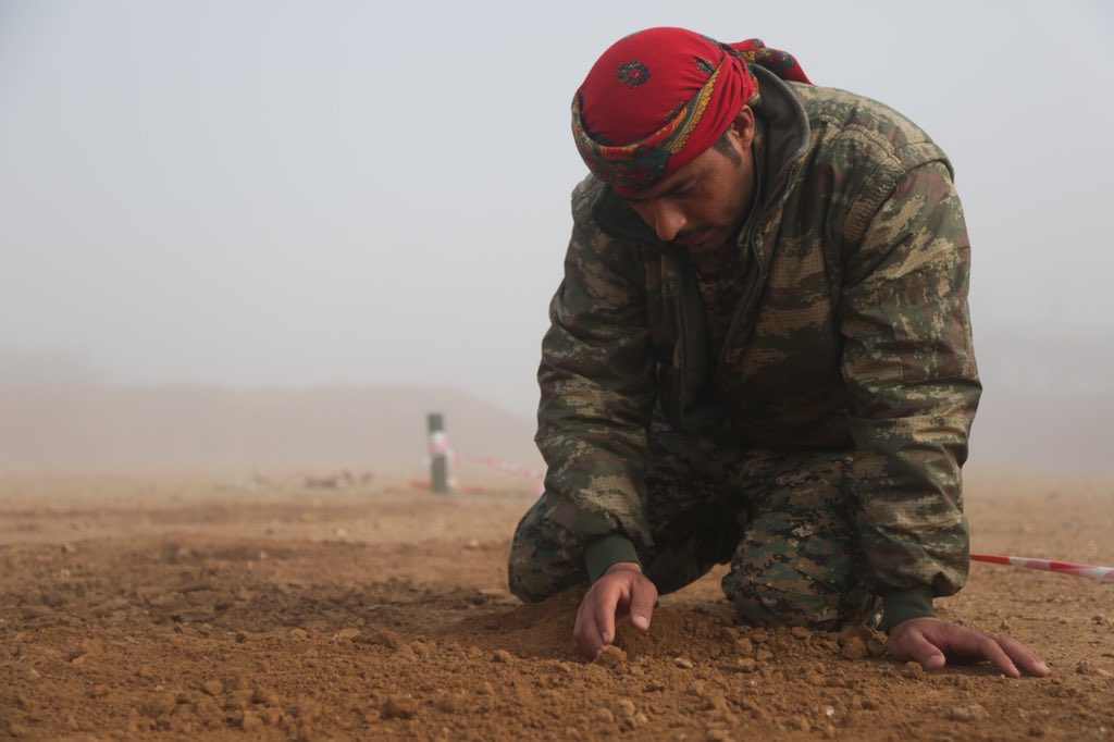 OIRSpox's tweet photo. Students from SDF attend basic counter improvised explosive device course. Trainees sweep through dirt, exposing fake IEDs, &amp; learn to dismantle/reduce threats. @CJTFOIR training enhances partner capacity, focusing on improving security capabilities. https://t.co/Jai9L3vB1l