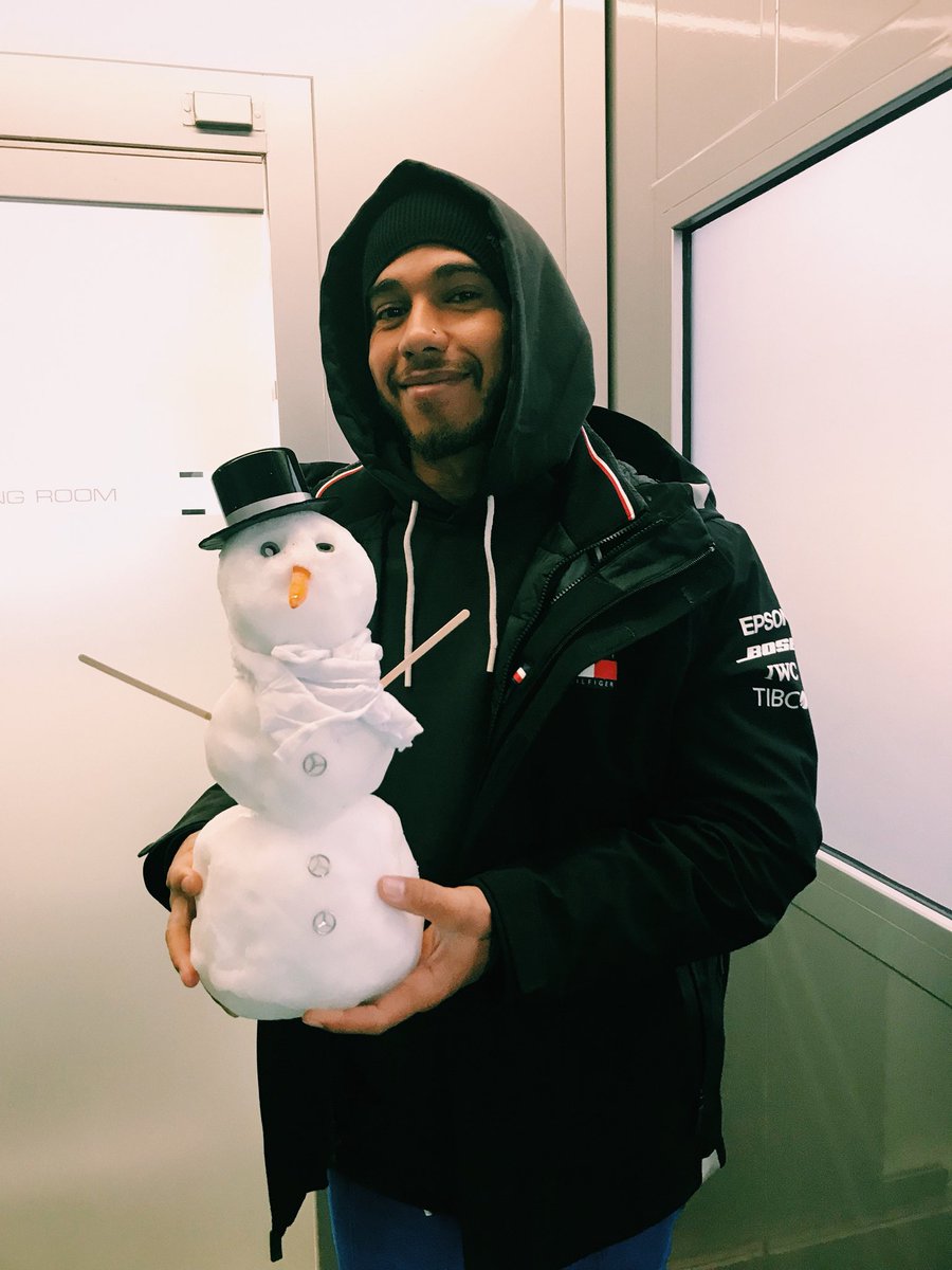 Lewis Hamilton holds the Team Snowman