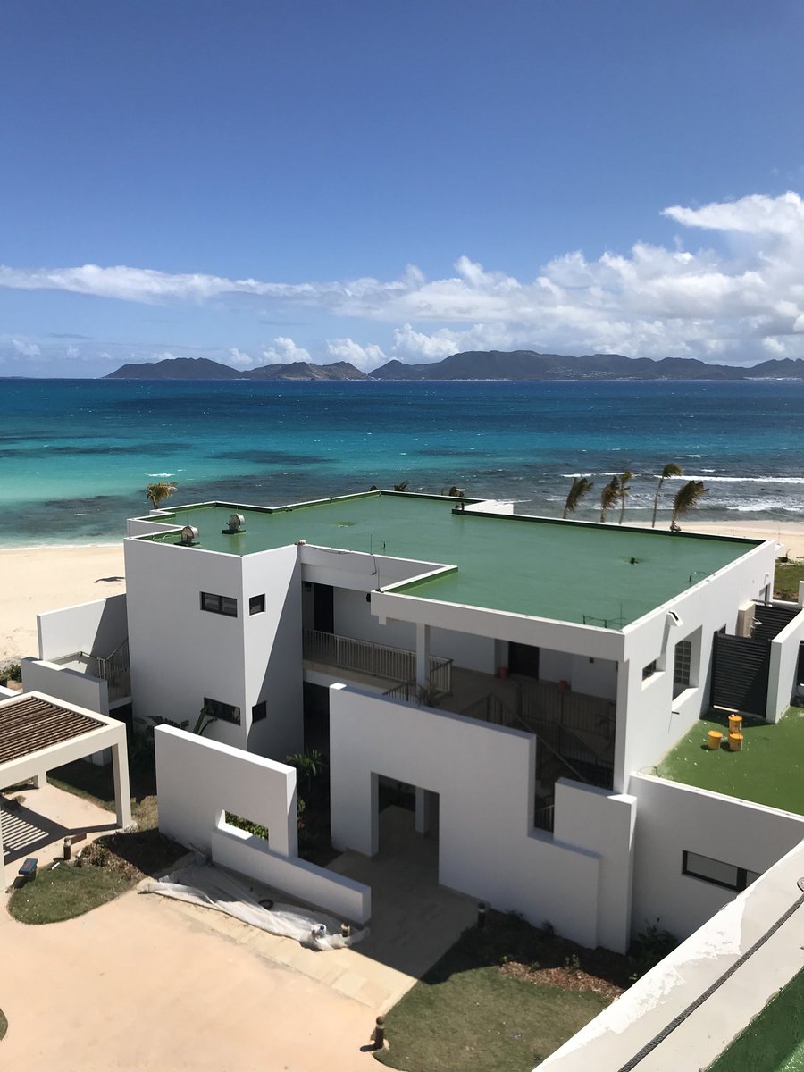 goodypne83's tweet photo. 1 of 4 villa roofs on a golf resort in Anguilla completed using @LiquidPlastics sikalastics 621 in grass green colour, also a lovely view with the island of St Maarten in the back ground π #SLProofwithaview https://t.co/FkWJqjyamQ
