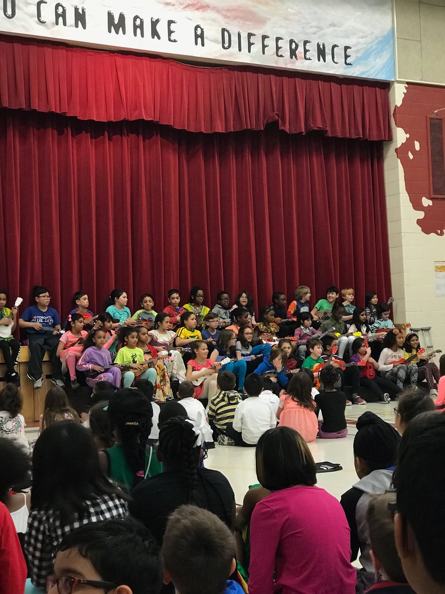Grade 4/5 Ukulele club performing at the Black History Month Assembly.
