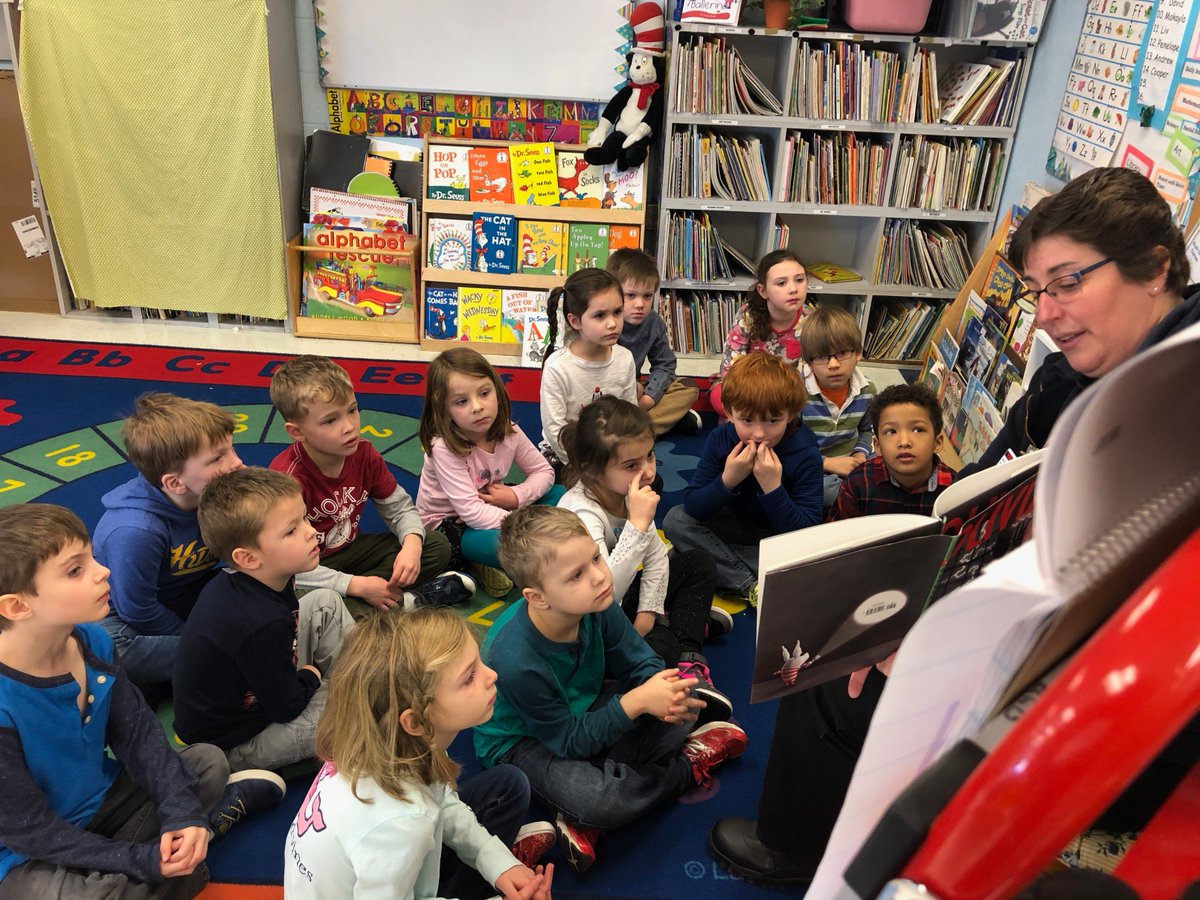 VESYork's tweet photo. Mrs. Gallagher and Mrs. Ellis' kindergarteners sit enthralled as Karen from https://t.co/FAFKPJlUMv reads Olivia, by @_IanFalconer, for the #ReadtoME Challenge.  #YSDMindset https://t.co/w5PF6EgPJn