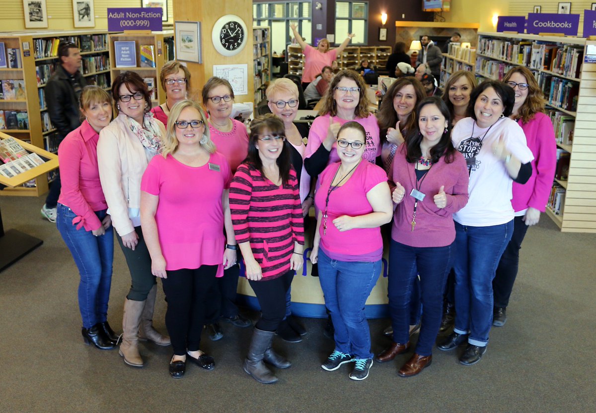 APL staff, and a patron (very happy person in the background), show support for Pink Shirt Day. You too can show support by remembering that nice needs no filter! Promote healthy relationships! #PinkShirtDay #airdrie #librarylife