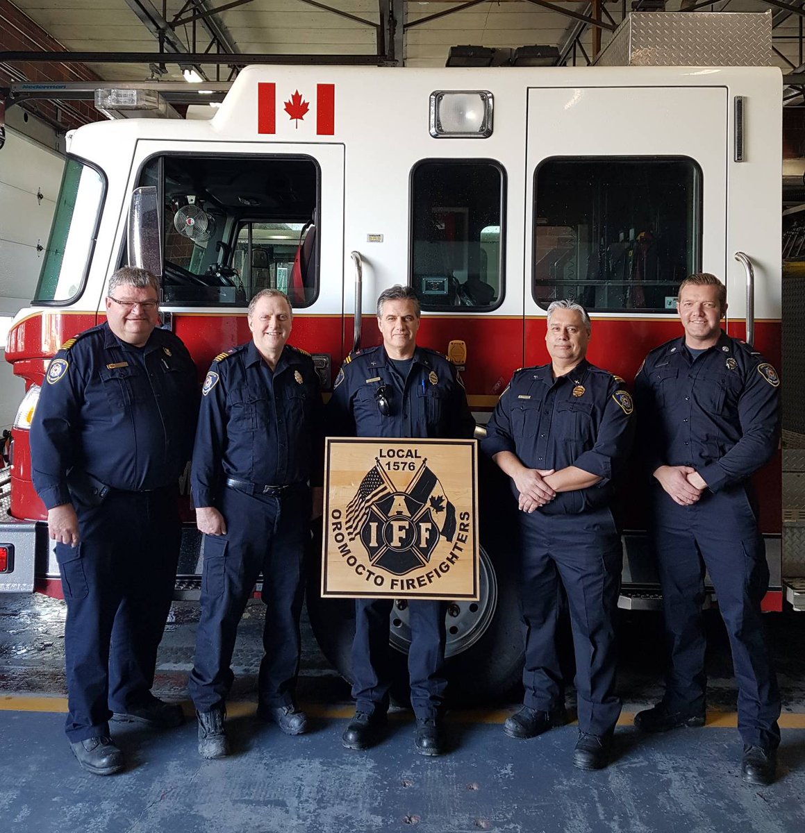 IAFF1576's tweet photo. At 3pm today dispatch systems across North America read a statement for the IAFF celebrating its 100th. We were able to have 5 of the last 6 Presidents of our Local present at our station to hear this. From left to right, J Price, R Cummings, A Hawkes, B Ferguson and M Vail. https://t.co/DBzpmCuo3h