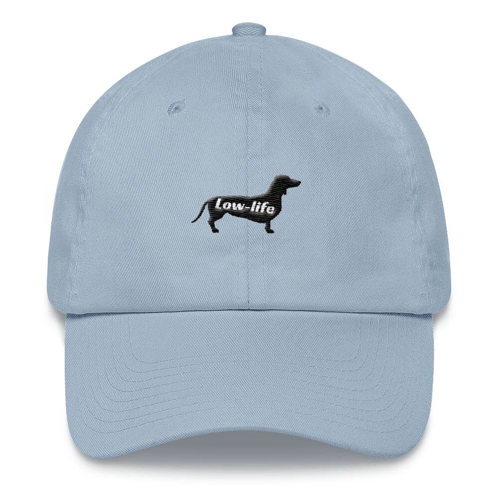 Check out our low-life dad hats! Dad hats aren’t just for dads. Get yours today with free shipping worldwide 🌎 wagsandwhiskers.com or click link in bio.