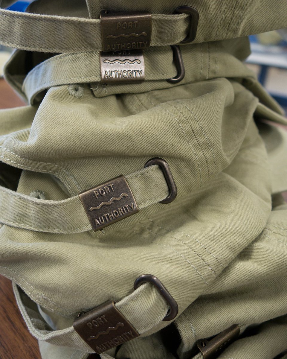 A stack of <a href="/sanmar_corp/">SanMar Corporation</a>  Port Authority hats about to be embroidered #hats #embroidery #chicoca