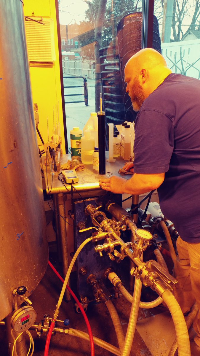BigGroveBrewery's tweet photo. Brewer Kent measuring how super the super stout is after 2 days brewing 4 batches with 16 hours of a super boil. Get ready for 5th #Anniversary in Solon. Soon to the barrels. #iowabeer #brewedinIowa #craftbeer #extremeplato https://t.co/rhJhncTXy9