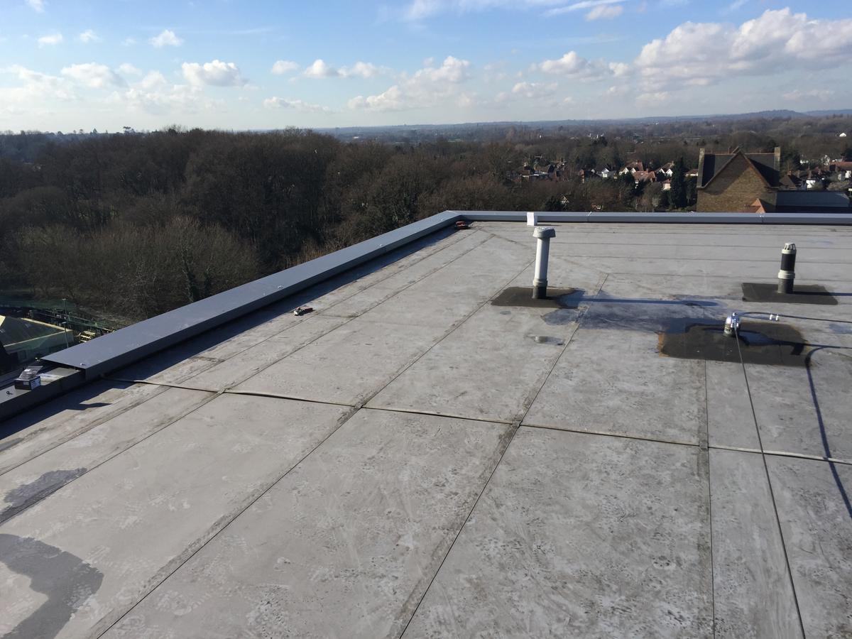 At Walton on Thames we supplied 2mm perimeter PPC copings around penthouse perimeters together with factory made welded corner profiles. Pressings were installed over existing ones as a means of preventing ingress into the plots directly below.