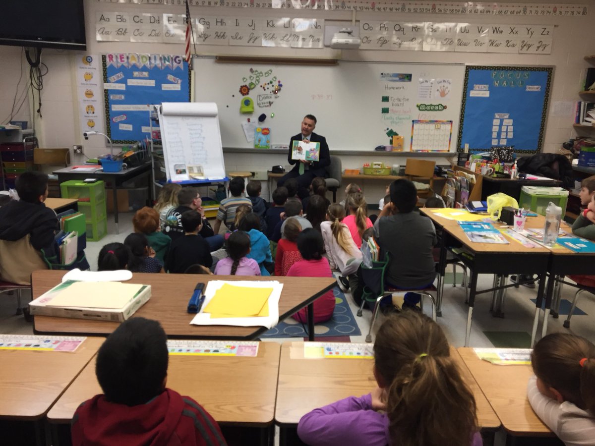 Mr.  Smith reads Dr. Seuss book to the second graders!@taraweber3702 @ghaschool <a href="/ptbeachsuper/">Will Smith</a>