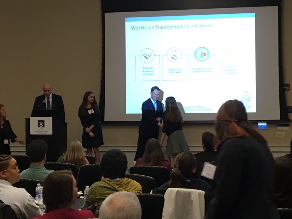 OhioOWT's tweet photo. Director Burgess and Josh Jennings awarding four students from @GIAcademy with @CIFTtweets new Food Industry-Recognized Credentials. “You are our future workforce” - Congratulations! #OhioWorks #OFIS18 https://t.co/KVdAwNUQRg