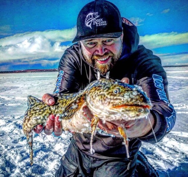 #burrrrrbot type of #thursday... a great #smile to go eith a great #catch from #ab! Solid 📸 by capt. Mitch! #exploreab #alberta #icefishing #redshinerfeature <a href="/TravelAlberta/">Travel Alberta</a> <a href="/NatureAlberta/">Nature Alberta</a> @TourismeAlberta