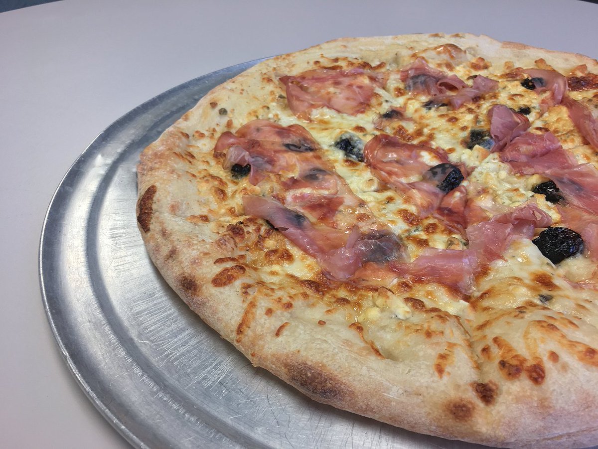 The March #Pizza of the Month is here! 🍕🐝🍒
The Bee's Knees Pizza: a garlic butter base, topped with Gorgonzola, mozzarella, and provolone cheeses, prosciutto, and dried bing cherries finished with a local <a href="/hucklebeefarms/">Huckle Bee Farms LLC</a>  orange #honey drizzle