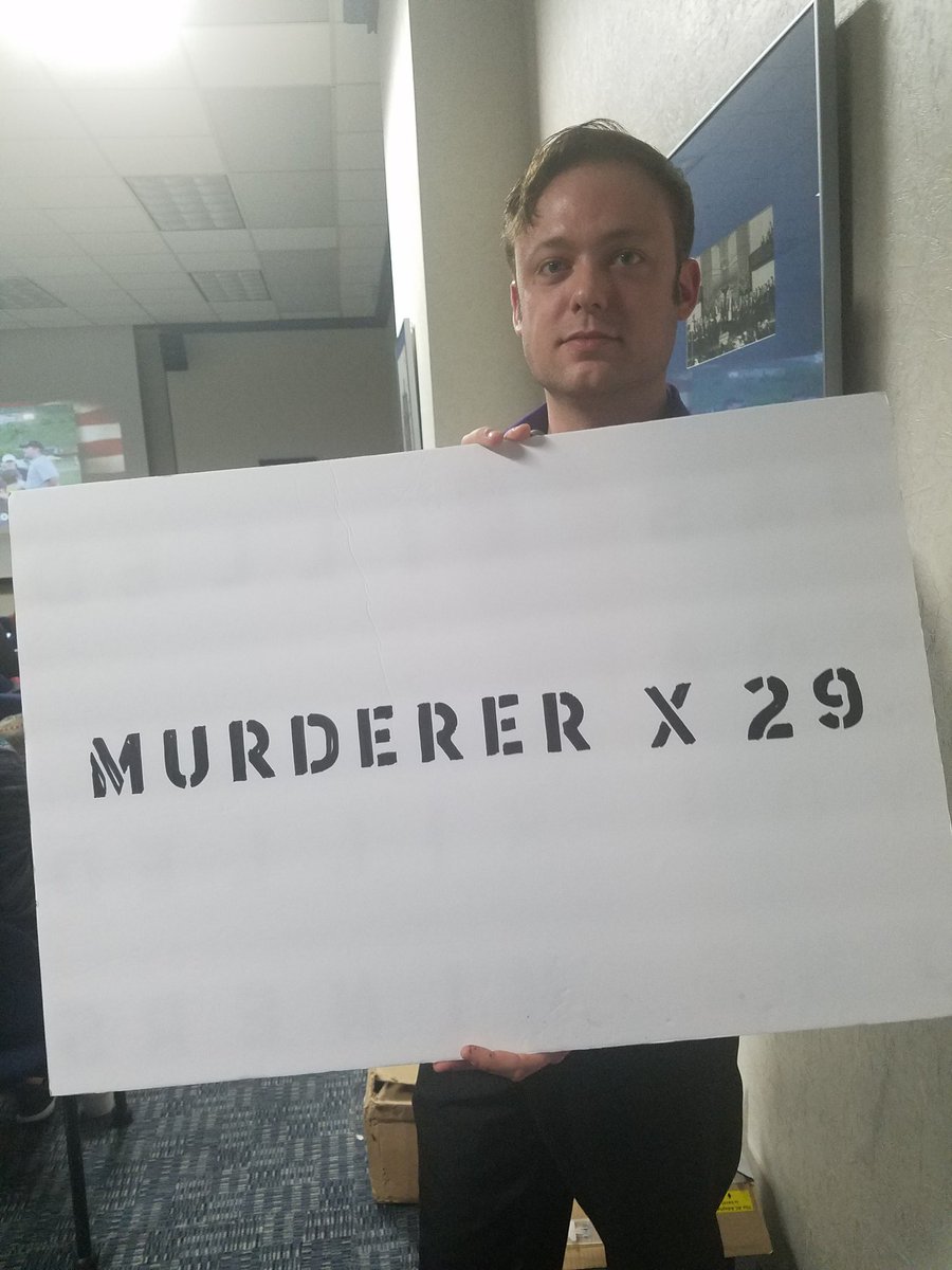 DailyAthenaeum's tweet photo. Austin Rempel, a WVU alumnus, brought a sign with him to the town hall. https://t.co/KedsXt93ip