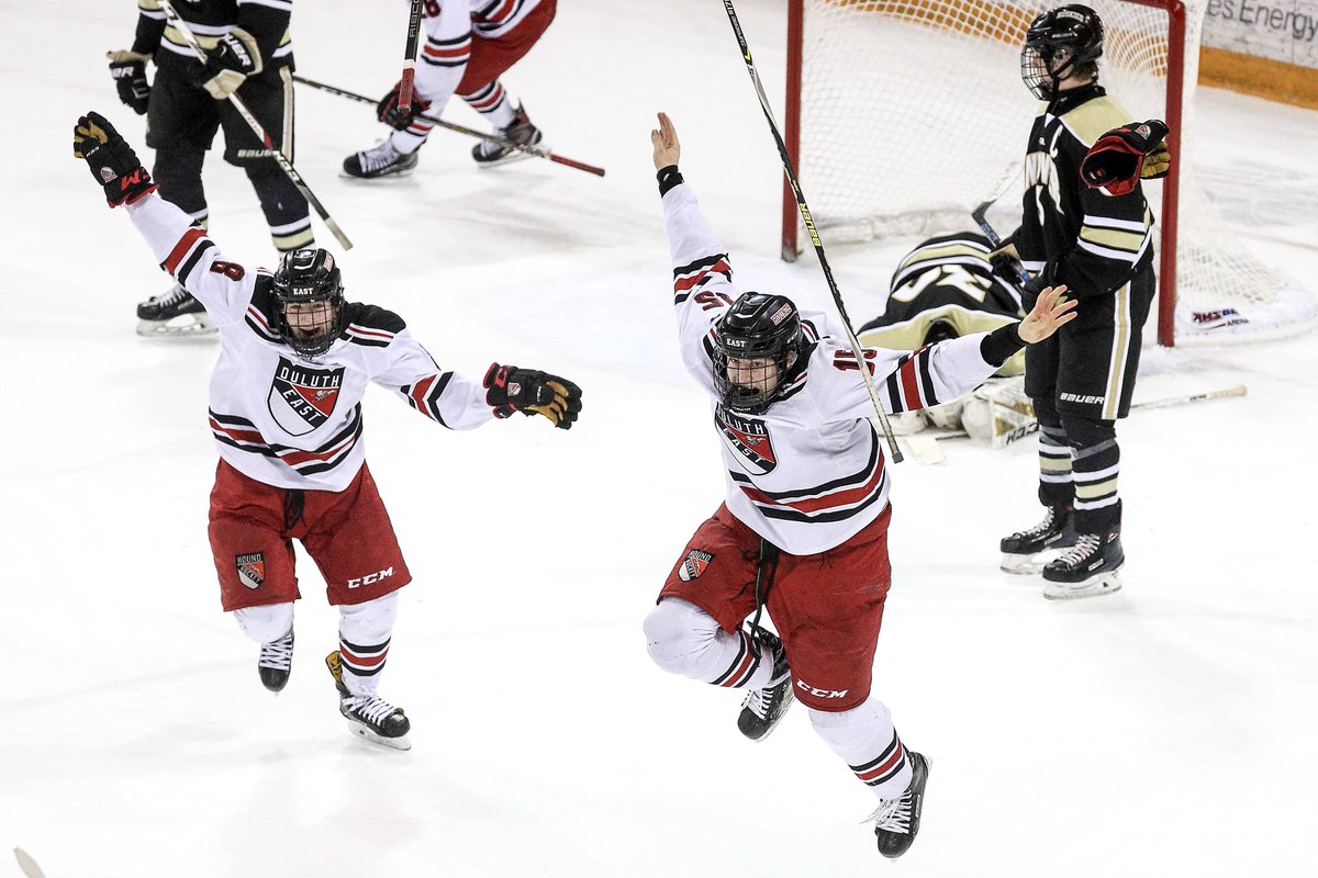 duluthnews's tweet photo. Austin Jouppi (8) and Ricky Lyle (15) of Duluth East celebrate after Logan Anderson (28) scored the game-winning goal in OT against Andover during the Section 7AA title game at Amsoil Arena in Duluth on Thursday. Check back for updates. 

Photo: Clint Austin/DNT https://t.co/iaiedBckqT