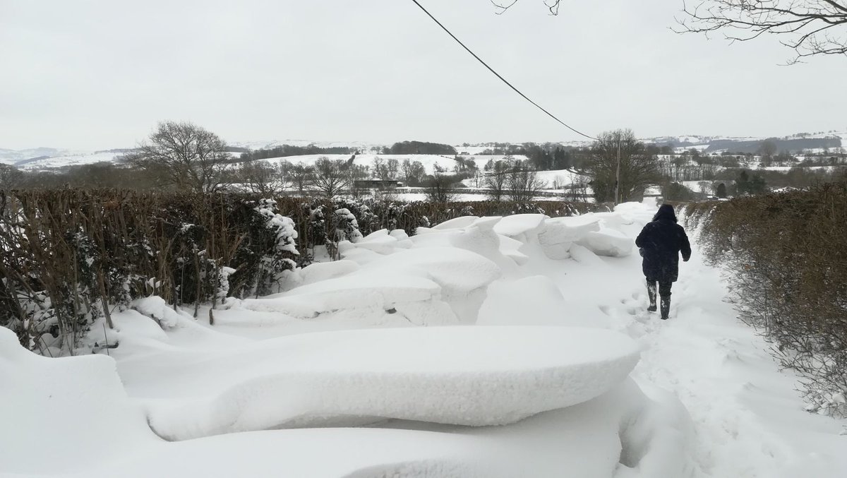 PowysCC's tweet photo. Our Reablement and Domiciliary Care staff have faced difficult and challenging conditions both day and night to deliver essential care and support for residents across Powys, often hiking through deep snow drifts to cover calls in very severe weather #thankyou #socialcare https://t.co/jGO9qqiokJ