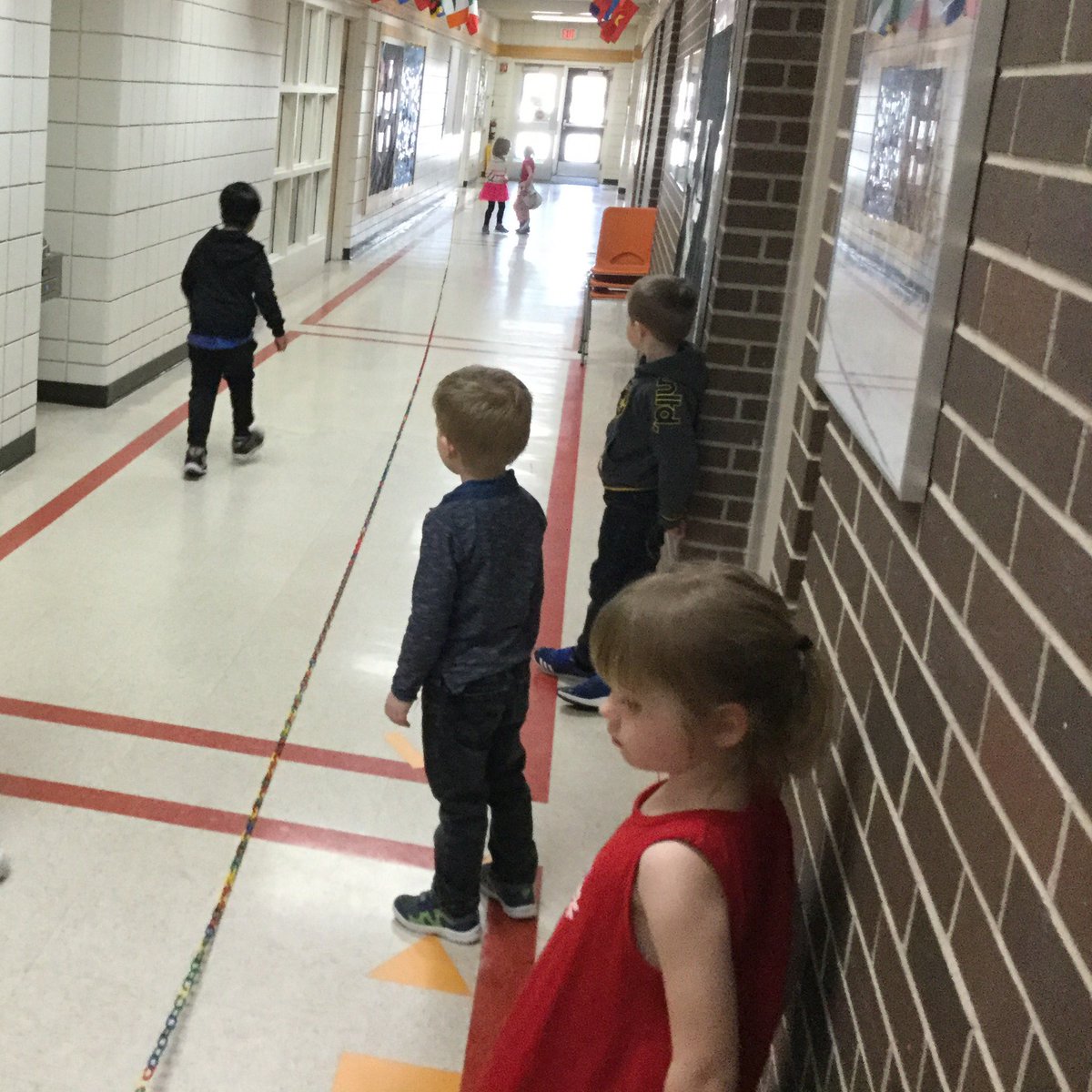 MsBottrell's tweet photo. What started off as “How long can we make our pattern?” Turned into a challenge of “Can we make the chain reach the office? Or the gym? Or outside?” We made it to the staff room! #seshsd #hsdlearns #collaboration https://t.co/pYC3FzGfqB