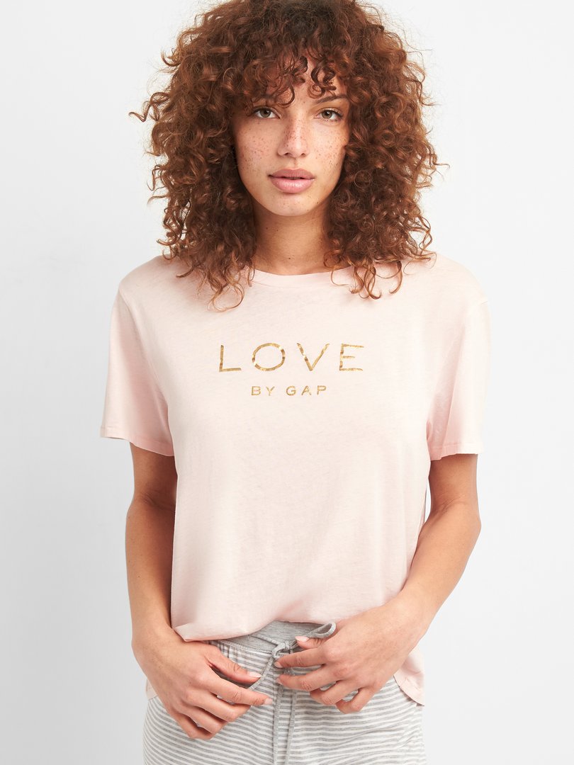 Gap's tweet photo. For #InternationalWomensDay, we're celebrating by empowering the women who make these Love tees with P.A.C.E., our education program that raises women’s voices — and donating $10K to our P.A.C.E. partner, CARE. Learn more: https://t.co/6O53l1cMrS https://t.co/FDtABpl2mP