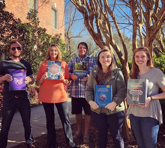 Hawkes_Learning's tweet photo. Happy #ReadAcrossAmericaDay to all! A few colleagues are casually reading our NEW textbooks on this beautiful Charleston day. We have new titles for #devmath and #Statistics. Plus, we have a new #grammar workbook and English guided notes! #highered #textbooks https://t.co/qjKOR7JTOq