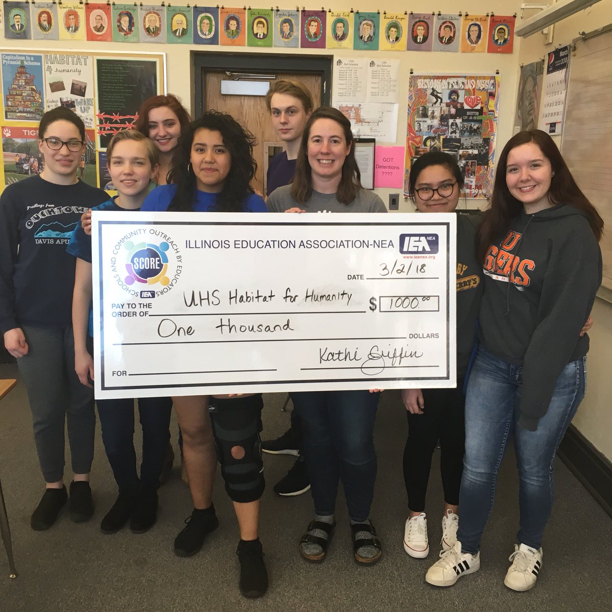 UHS_Habitat's tweet photo. We got a big check! Thanks to @ieanea for the grant, which we use to help students afford the fees for our service learning trip to Tutwiler, MS. #IEAhelpsout #TeachUrbana #MyTigers https://t.co/RaT7WS3f9e