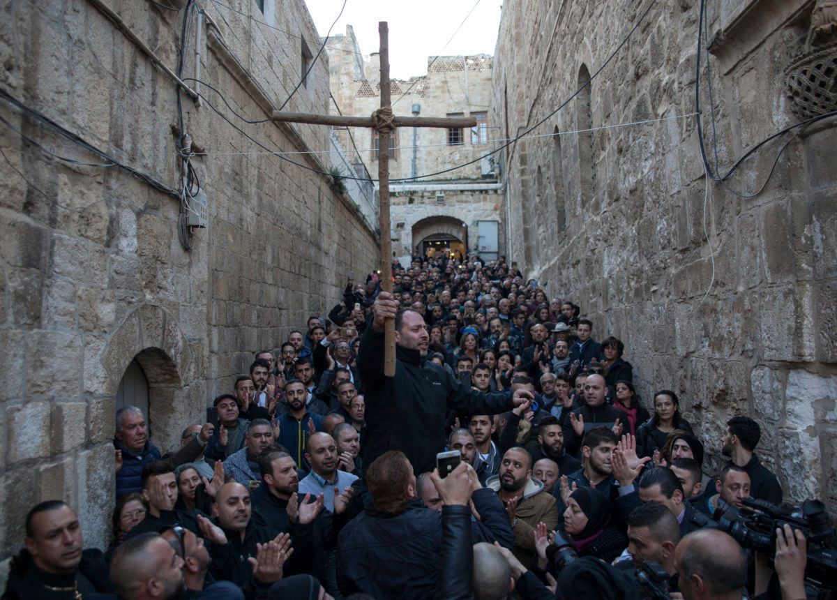 Mondoweiss's tweet photo. Palestinian Christians &amp; Muslims march together to the Church of the Holy Sepulchre to protest to a new Israeli tax policy and proposed property law which caused #Christian leaders to shut the doors of the church Sunday. (Photo: Seth Herald)

https://t.co/xkC5O9fFxq

#Palestine https://t.co/ZOWf6nqQPC