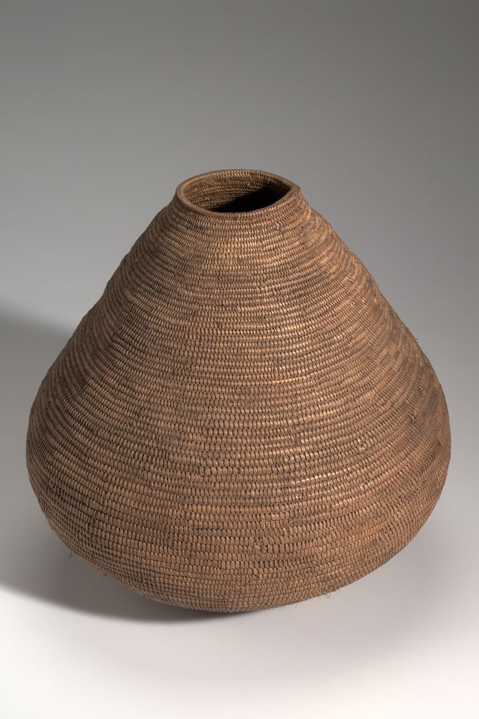 Zulu basket from 1900 on left, Tlingit basket (unknown year) on right