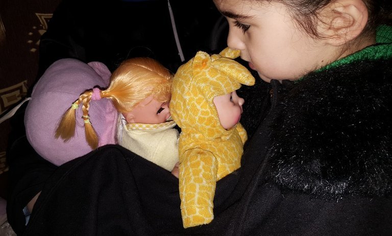 Her dolls provide small comfort as this five-year-old shelters in a basement of besieged Eastern Ghouta as Syrian and Russian planes bomb above. bit.ly/2FNIiuj
