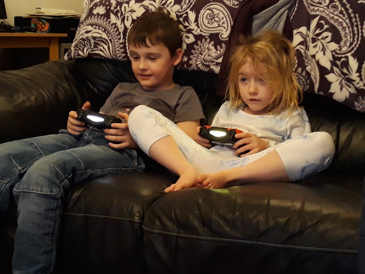 lddowson's tweet photo. @JesmondY2 @jesmond_gardens Max enjoying the waves at the headland and playing a computer game with his cousin Elizabeth! https://t.co/c3orjosMGj