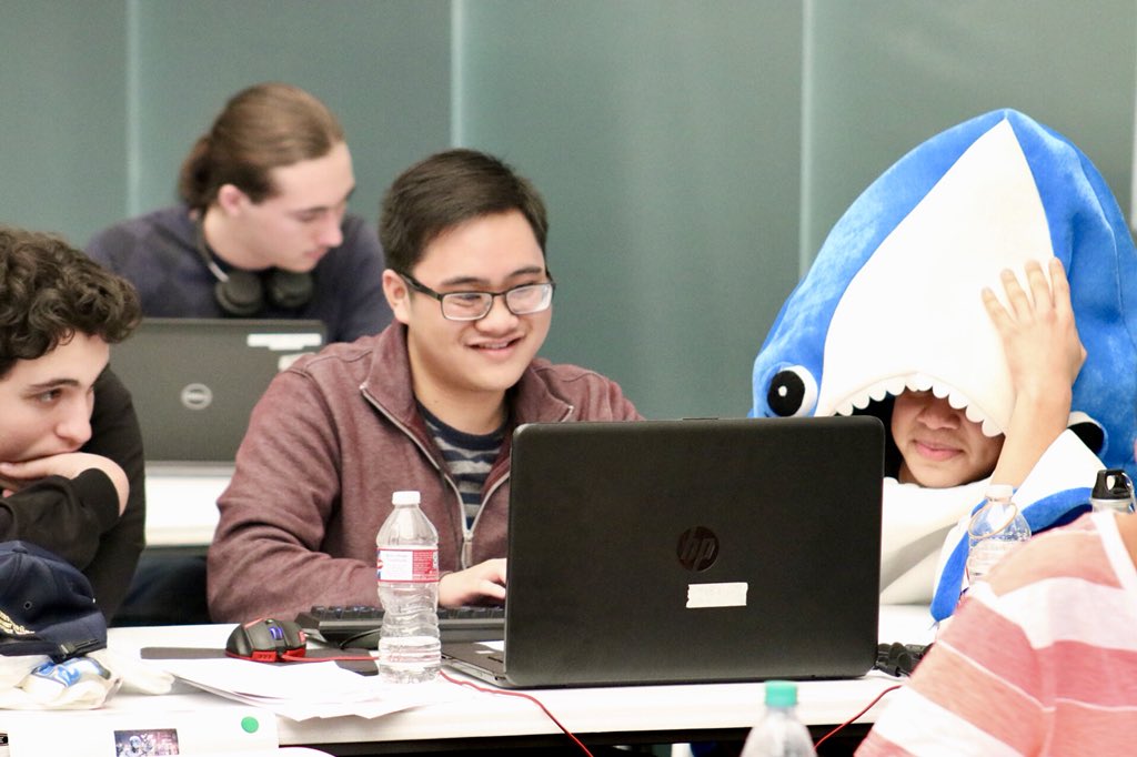 Wirelessnerd's tweet photo. Teams were challenged to complete challenges and puzzles at @HPE #CodeWars2018. In the middle of competition, the stress of 750 students competing was palpable! Especially for the shark guy!! https://t.co/zc3qVrM24I