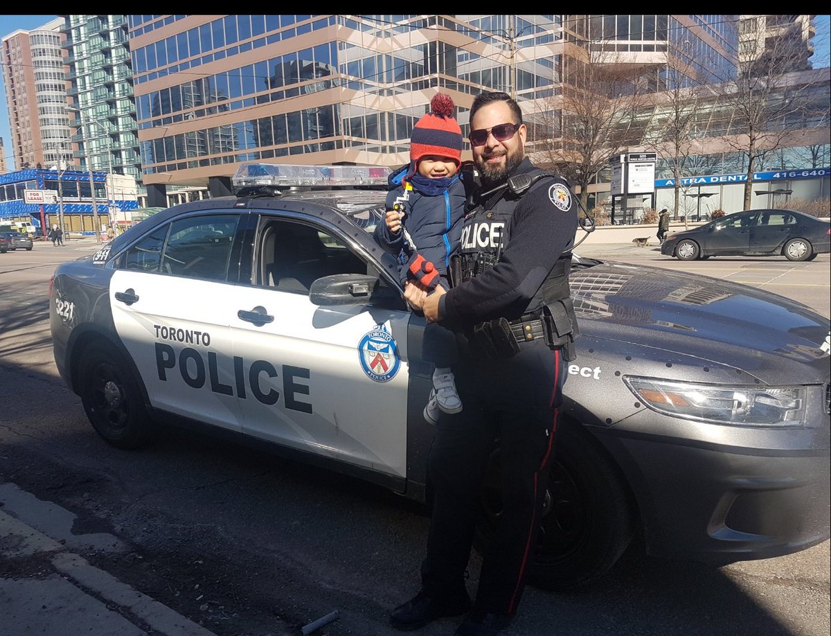 TorontoPolice's tweet photo. I noticed little 3 year old Miguel waving at the police car as he walked by with his mother today. I had to stop and say hello to the little guy and his mother. Mom took lots of pics and thanked me. A future officer?! #HowWeDoItTPS ^sm for PC EBRAHIM #9159 https://t.co/ytttzrzxdH