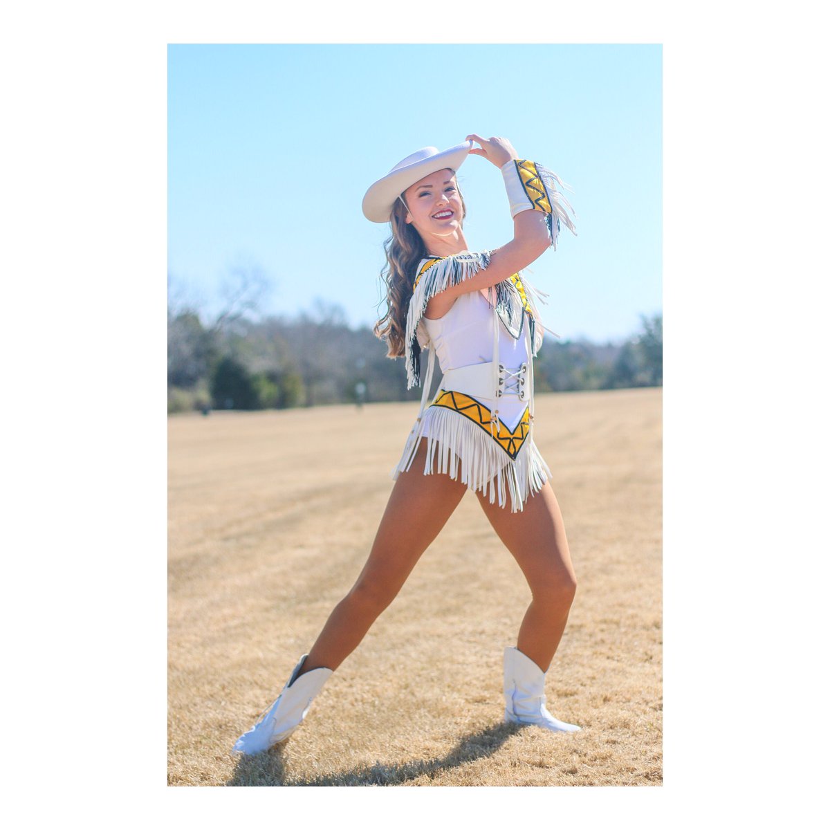 mollie_mayfield's tweet photo. Took photos of the beautiful @ApacheBelles Head Dance Captain @BmileyMiley this morning 💛🖤 #ApacheBelles #TJC #EastTexas https://t.co/g5izQwceyx