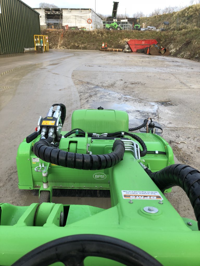 Giving the yard a good clean with the amazing Avant Sweeper attachment!