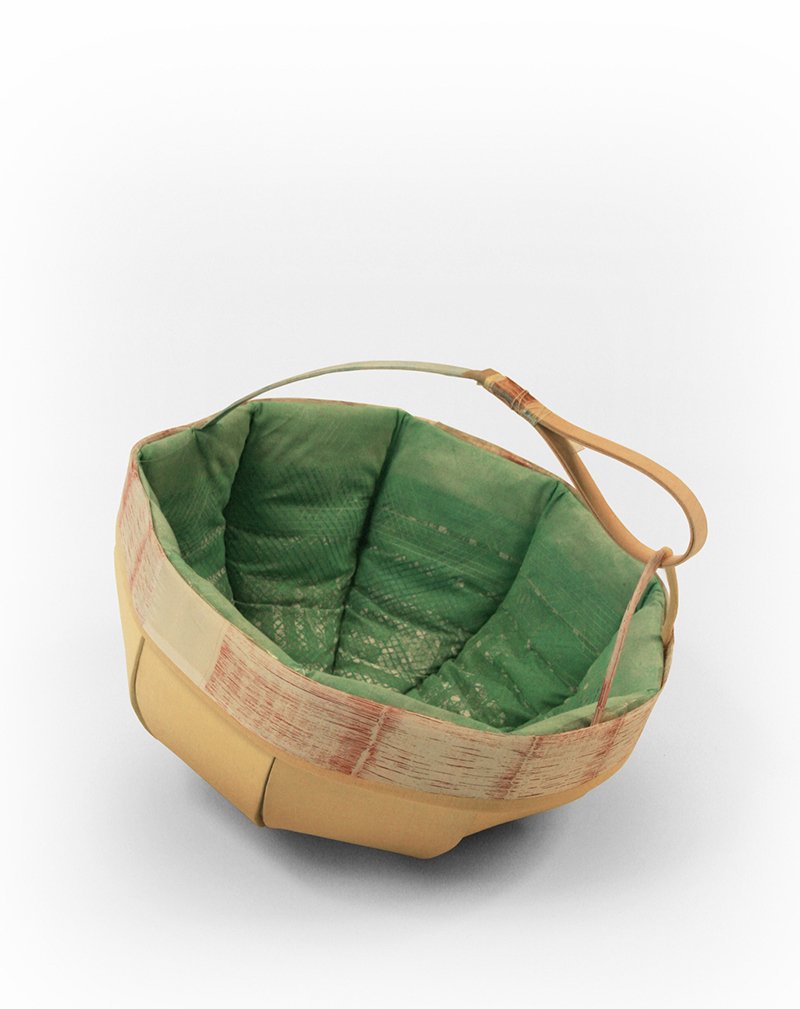 this dienke dekker basket feels comforting in a childlike way — like those baskets made of construction paper? mixed with a child's bedspread?