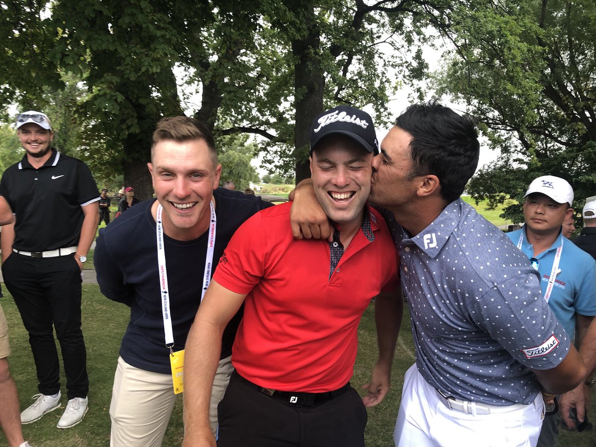 PGAofAustralia's tweet photo. Kisses for a champion from a champion 💋💋
2012 champ Jake Higginbottom and 2014 champ @dimipapadatos congratulate 2018 @NZOpenGolf champ Daniel Nisbet! #NZOpen99 https://t.co/ahYUk5Y7G1