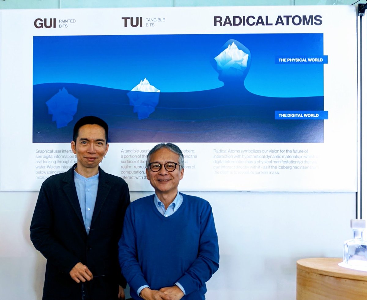 ishii_mit's tweet photo. 2017-01-10 with @johnmaeda in front of the blue iceberg model of “painted bits => #TangibleBits => #RadicalAtoms” at the @medialab. https://t.co/VbmYs5oasn