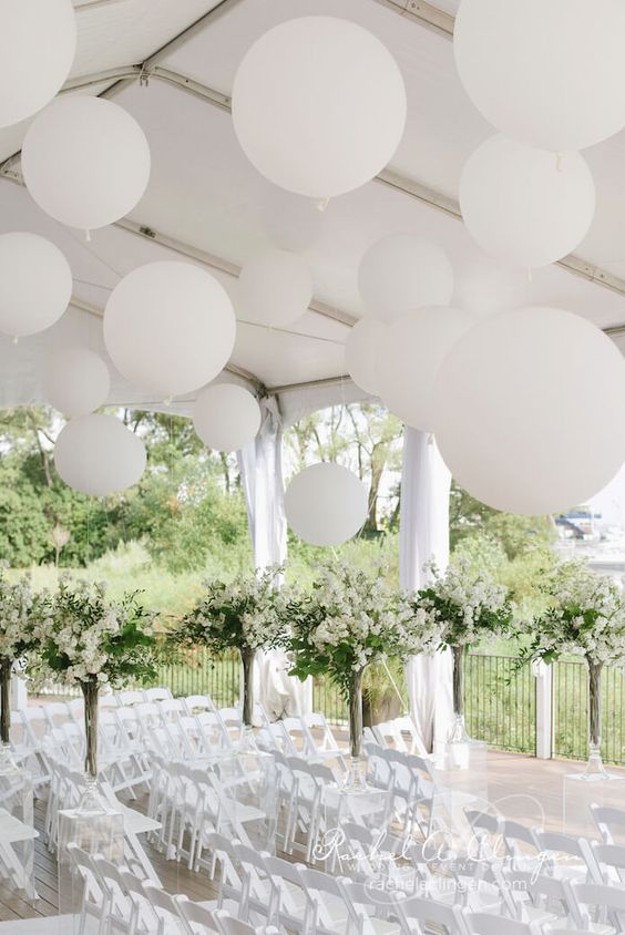 How beautiful do these large balloons look, simple but elegant and effective! #wedding #balloons #weddingballoons @WDdresses