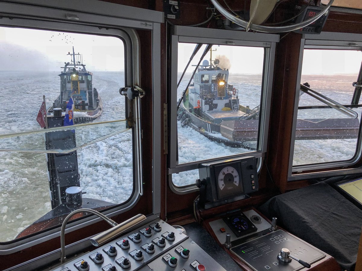 Tugs breaking ice on Netherlands largest fresh water lakes Marker- and IJsselmeer