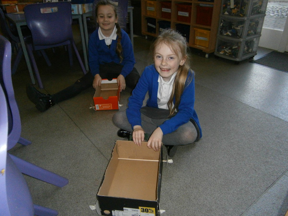 Busy designing and making our own moving vehicles. Will they work?