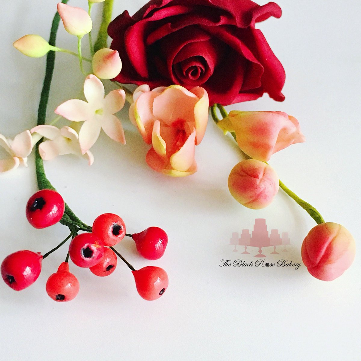 BlackRoseBakery's tweet photo. Sugar flower red rose, freesia, red berries, cherry blossoms buds #redrose #freesias #redberries #buds #cherryblossoms #gumpaste #sugarflowers #cakedecorating #sugarspray #classess @cakeacademywales #original #pastrychef #sugarflowermaster #squireskitchenproducts https://t.co/MratHOVcBr